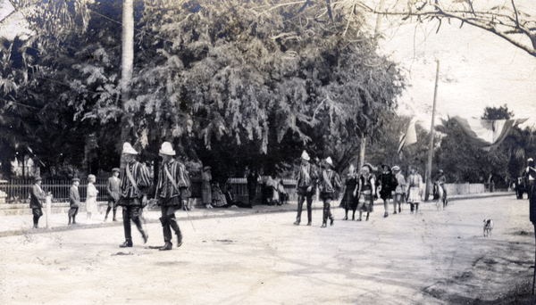 Koreshans, dressed in costume, marching in a parade.