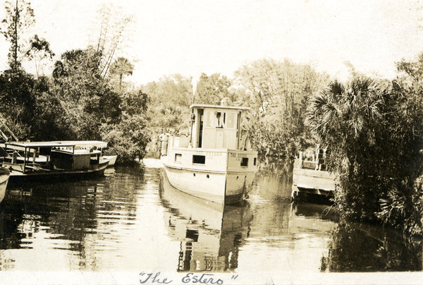 Postcard showing the Koreshan Unity boat "The Estero" on the river.