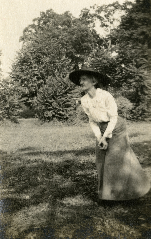 Koreshan Annie Ray Andrews catching a baseball.