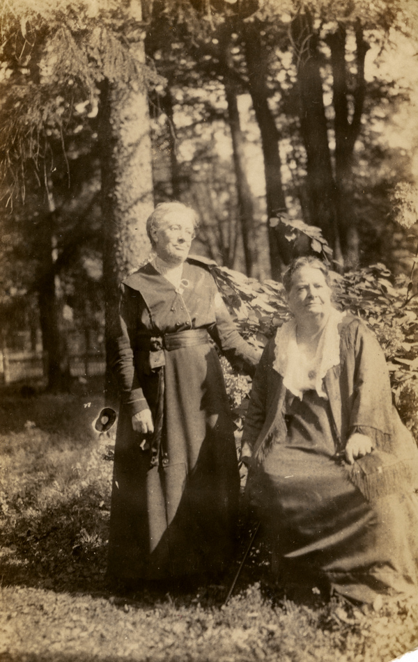 Koreshan Berthaldine Boomer, seated, with a friend.