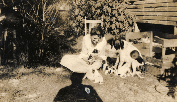 Koreshan Hattie L. Englert with dog and her puppies.