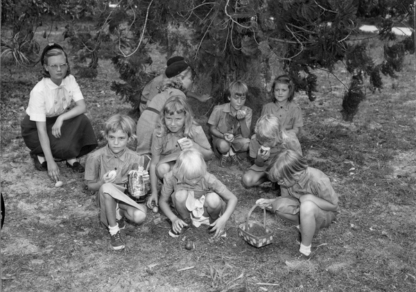 Girl scouts with Easter eggs after a hunt at Koreshan Unity in Estero, Florida.