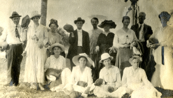 Group portrait of Koreshans with coconuts.