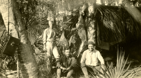 Portrait of Koreshan hunters Jesse Putnam, Laurie Bubbett and Charlie Hunt at their camp.