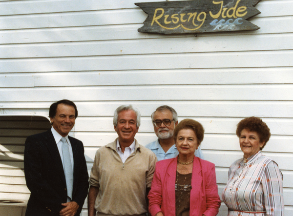 Koreshan Unity president Jo Bigelow, at right, posing with folks at Rising Tide Cottage.