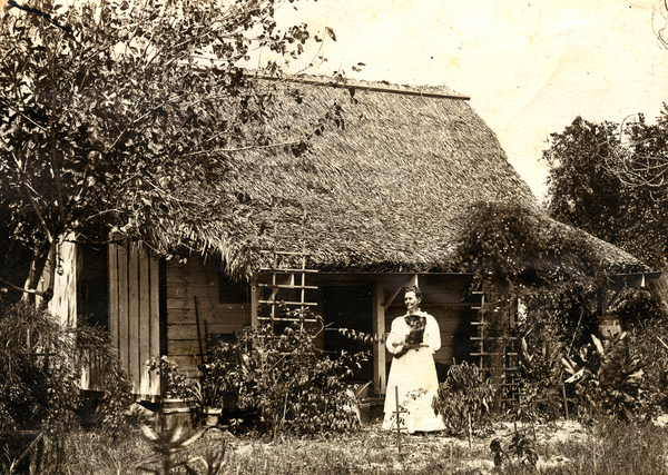 Unidentified Koreshan woman standing in front of her home in Estero, Florida.