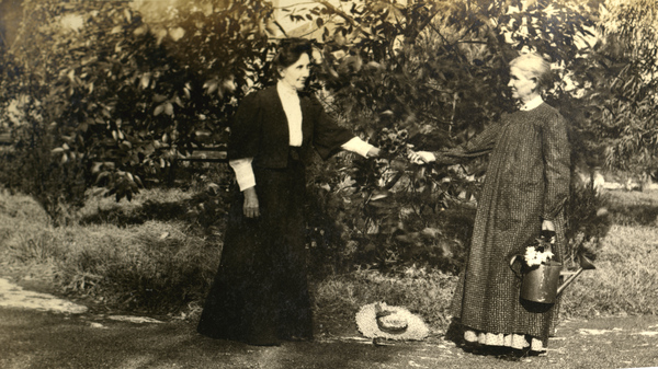 Two Koreshan women with flowers.