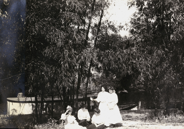Annie Ray Andrews, seated left, with small group of Koreshan ladies at Bamboo Landing in Estero, Florida.