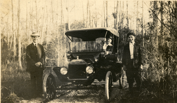 Koreshans posing in the woods with ford automobile while on the way to Fort Myers.