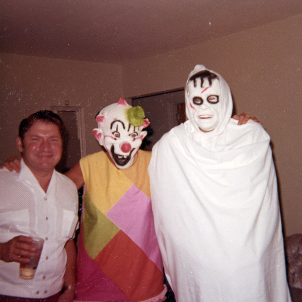 People in costume posing at a Koreshan Unity Halloween party.