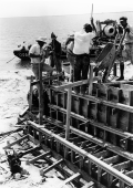Close-up view showing concrete being poured during construction of hydraulic structure on Lake Okeechobee.