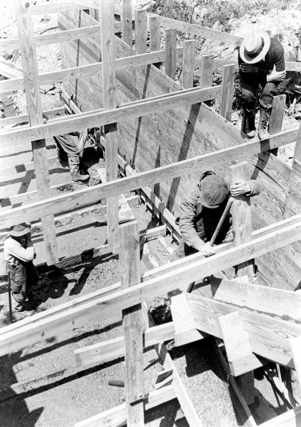 Close-up view showing workers pouring concrete during hydraulic lock construction at Lake Okeechobee.