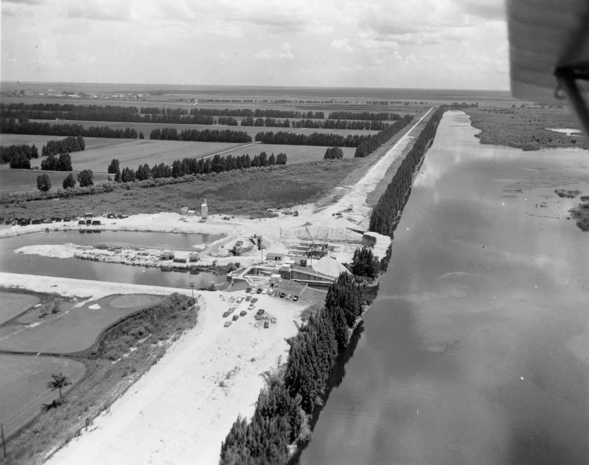 Aerial view overlooking pumping station and hydraulic gate in the CSF Flood Control District near Lake Okeechobee.