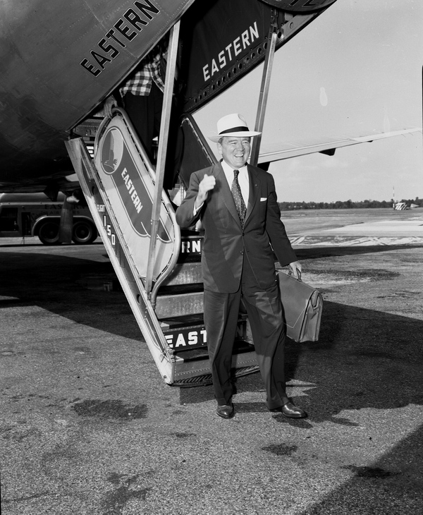Ex-governor Fuller Warren arriving in Tallahassee on an Eastern Air Lines flight.
