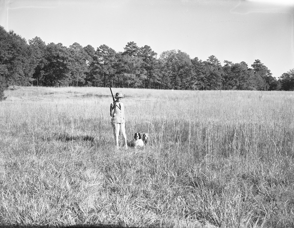 Mrs. Lloyd Griscom with her gun and dogs at Luna Plantation near Tallahassee.