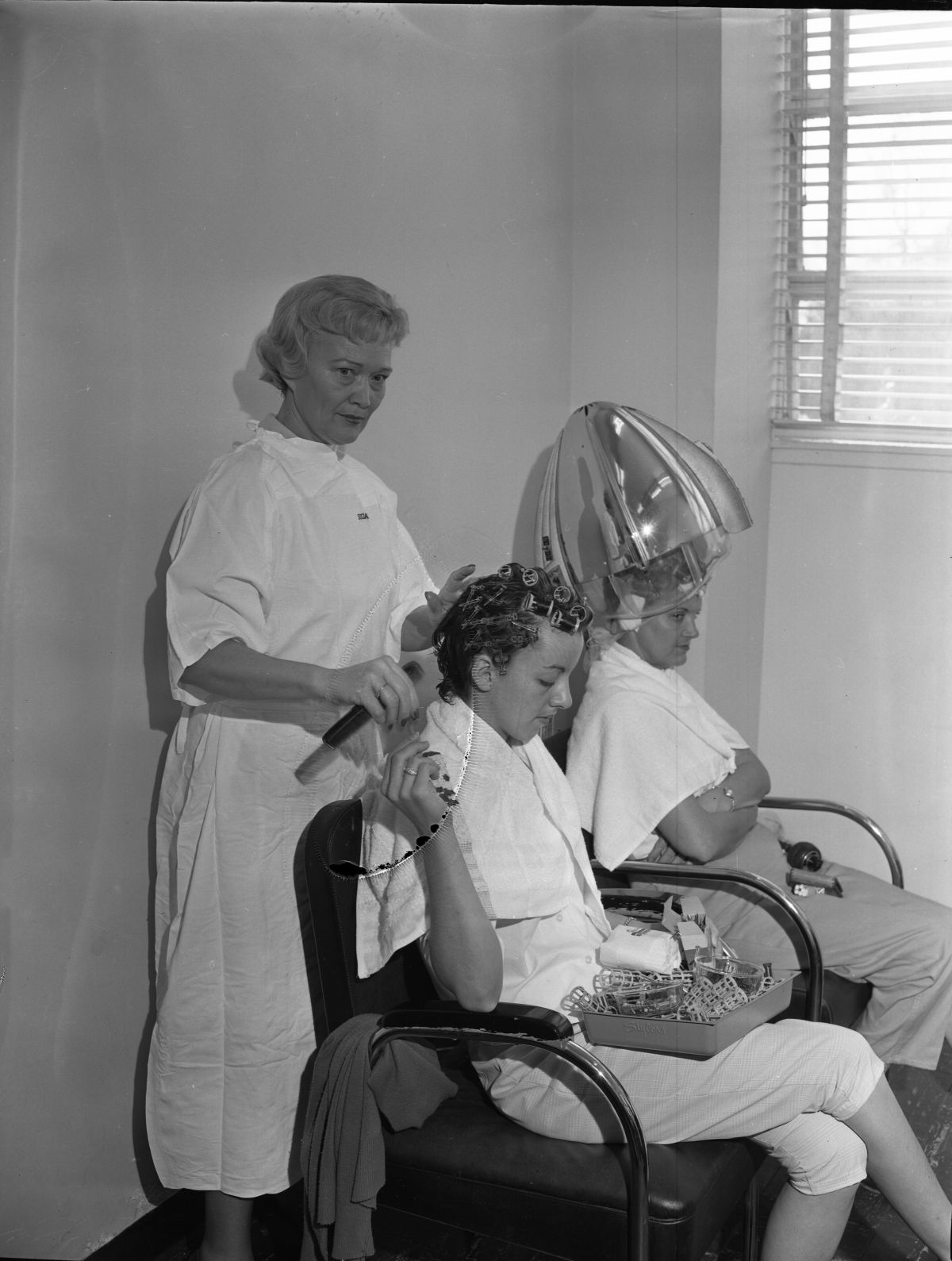 Mrs. Ira Hopkins styling hair at the W.T. Edwards Tuberculosis Hospital in Tallahassee.