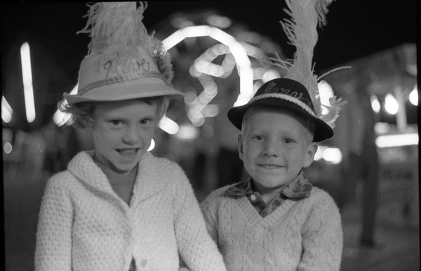 Guthrie children wearing hats with plumes at the North Florida Fair in Tallahassee.