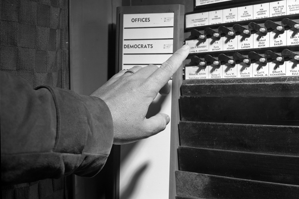 Close-up view showing decision for president being made at a voting machine in Tallahassee.