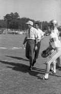 FSU head coach Bill Peterson on sideline with players during game in Tallahassee against the University of Kentucky.