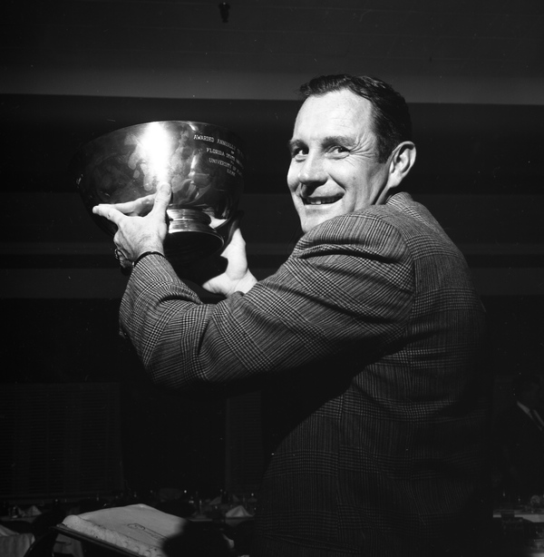 FSU's head football coach Bill Peterson hoisting the Governor's Cup trophy in Tallahassee.