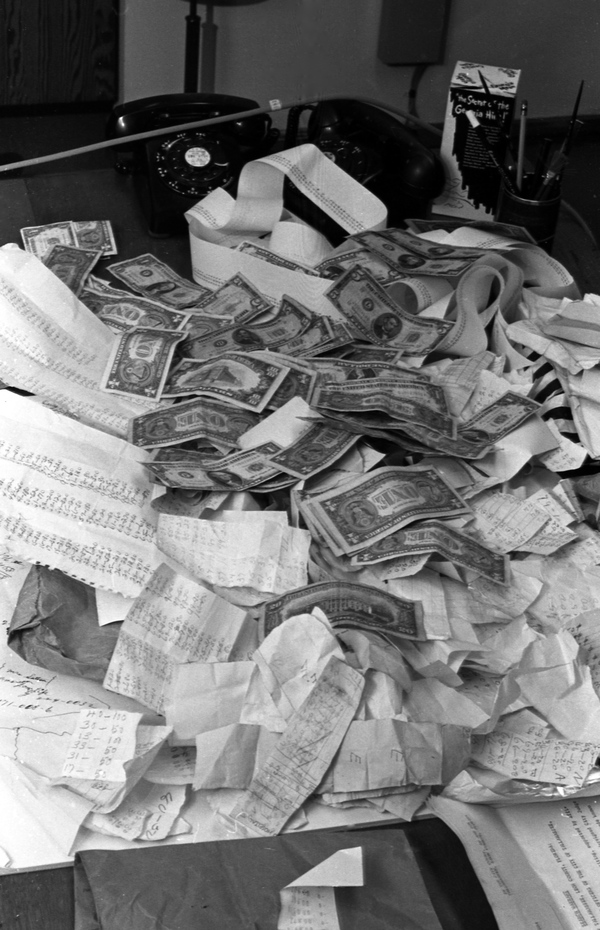 Cash and items seized during a bolita raid in Tallahassee.