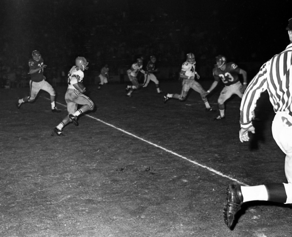 FSU player running with the football during game in Tallahassee against the University of Houston.