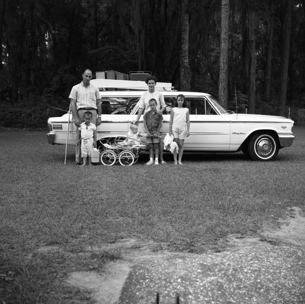 Wilson Carraway Jr. family standing by Country Squire station wagon ready for their family vacation.