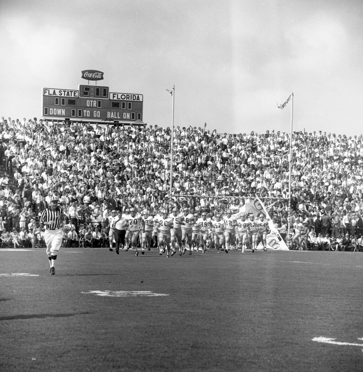 FSU football players taking the field at Doak Sheridan Campbell Stadium in Tallahassee for game against UF.