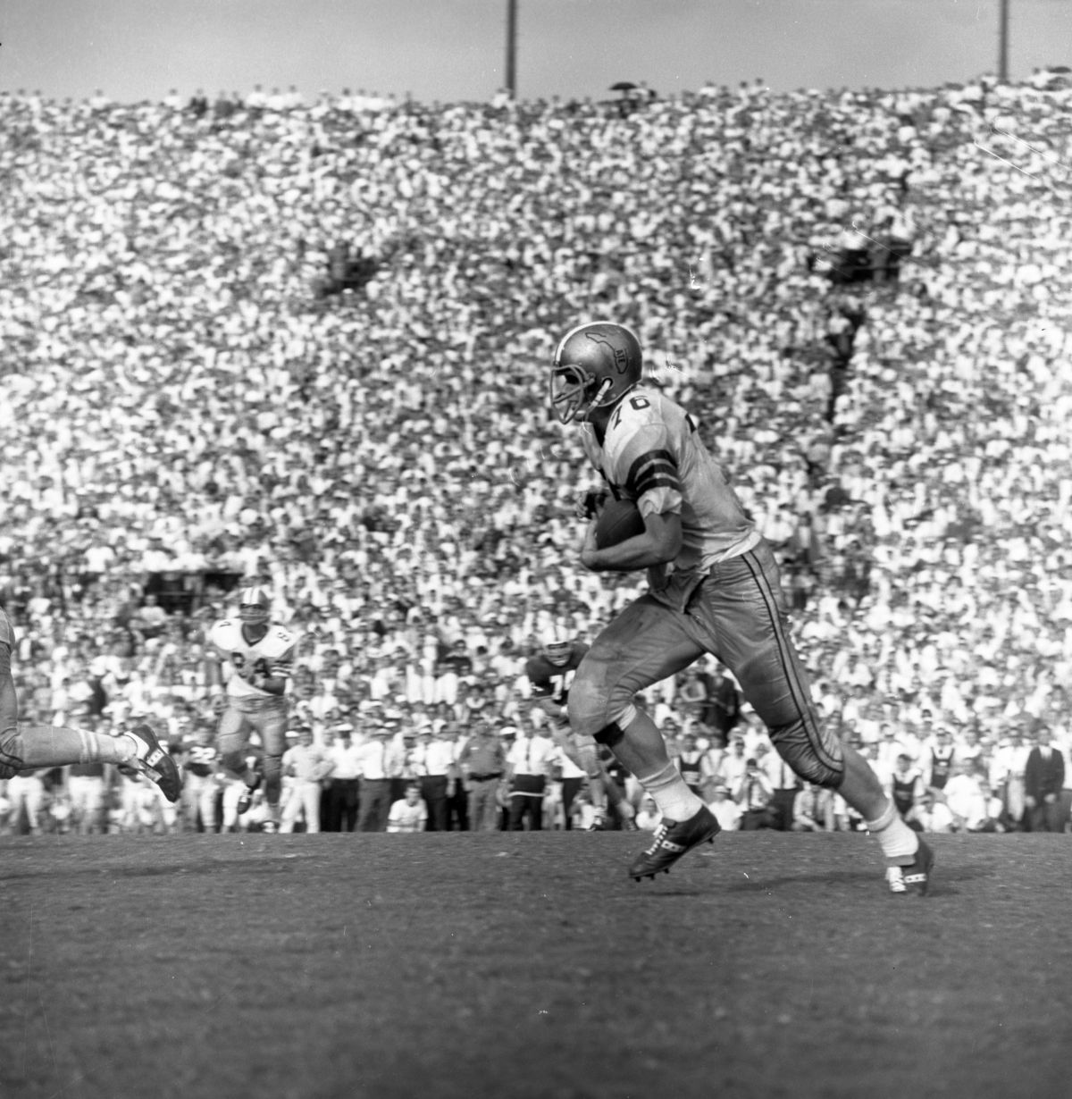 FSU player running with the football during game against UF in Tallahassee.