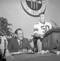 FSU football coach Bill Peterson listening as #50 Dale McCullers introduces himself during luncheon in Tallahassee.