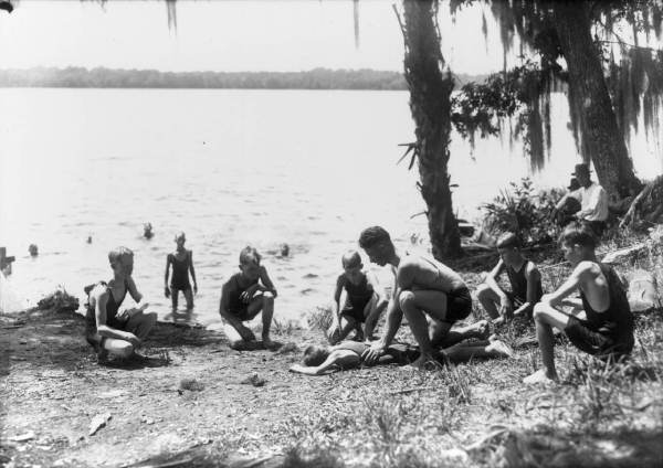 Leland Hiatt showing club boys how to resuscitate the drowned