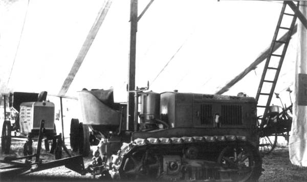Tractors under a tent during Farmers Week - early Extension work
