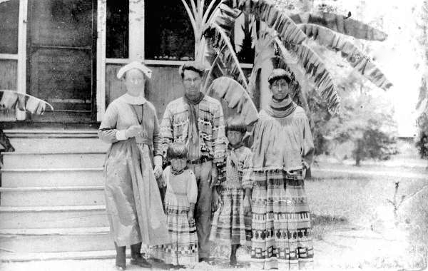 Deaconess Bedell and the Buster family, outside the Glade Cross Mission - Everglades City, Florida