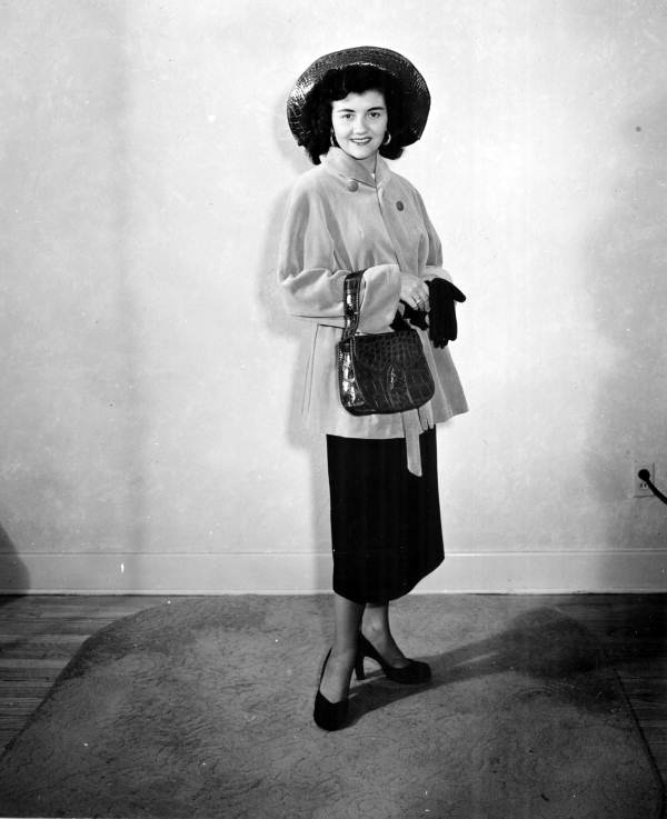 Unidentified woman modeling an alligator handbag from the Wild Animal Farm in Saint Petersburg, Florida.