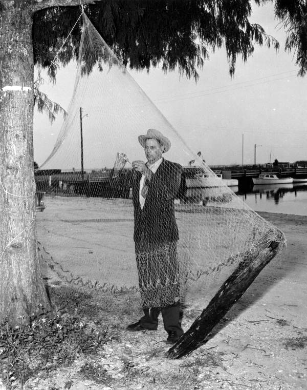 H.O. Marshall mending his net in Apalachicola, Florida.