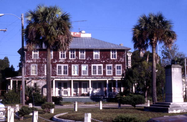 View of the Gibson Inn with the Marks Memorial in the right foreground - Apalachicola, Florida.