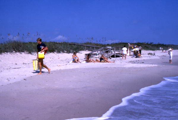 View showing people at the Canaveral National Seashore beach in Brevard County near Titusville, Florida.