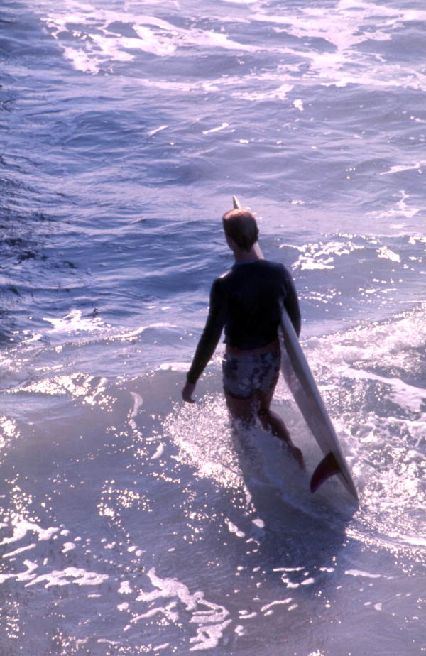 Surfer with his board at Cocoa Beach, Florida.