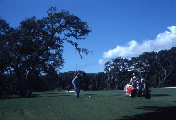 Golfer teeing off at a course on Amelia Island, Florida.