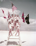 Miss Fiesta contestants posing on lifeguard stand during the Fiesta of Five Flags in Pensacola.