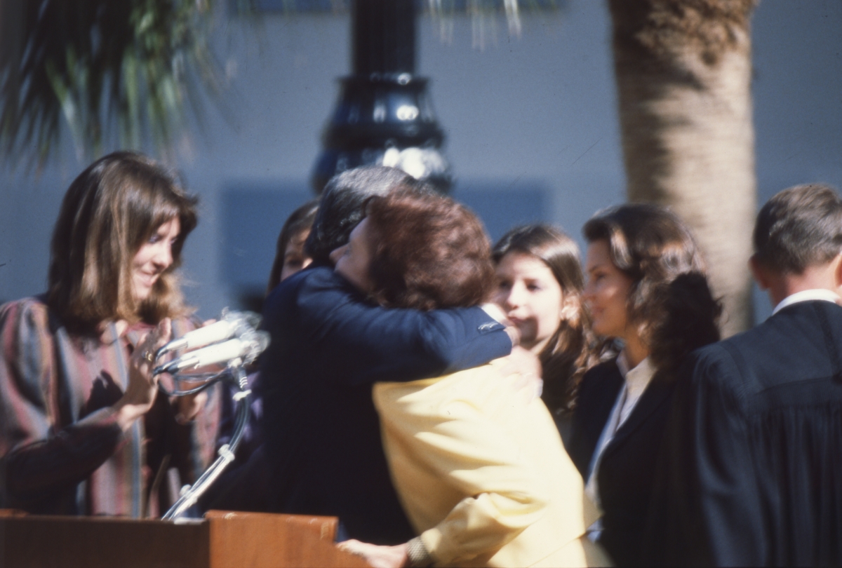 Governor Graham hugging his wife during his inauguration in Tallahassee.