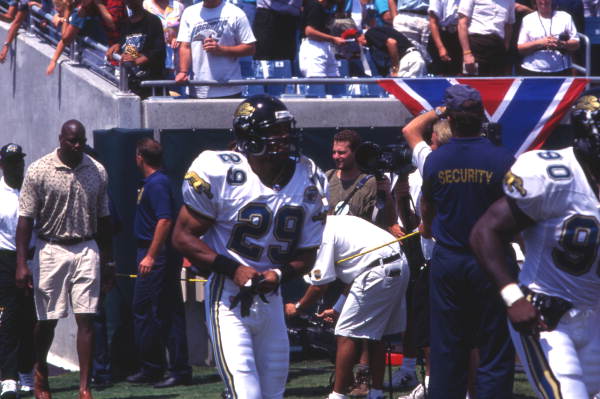 Jacksonville Jaguars #29 Darren Carrington heading to field with team during their inaugural game against the Houston Oilers.