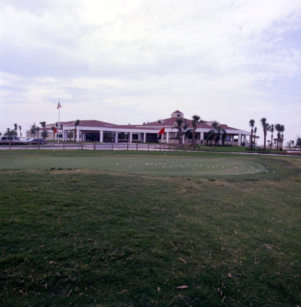 View looking past putting green toward the clubhouse at the Cocoa Beach Country Club.