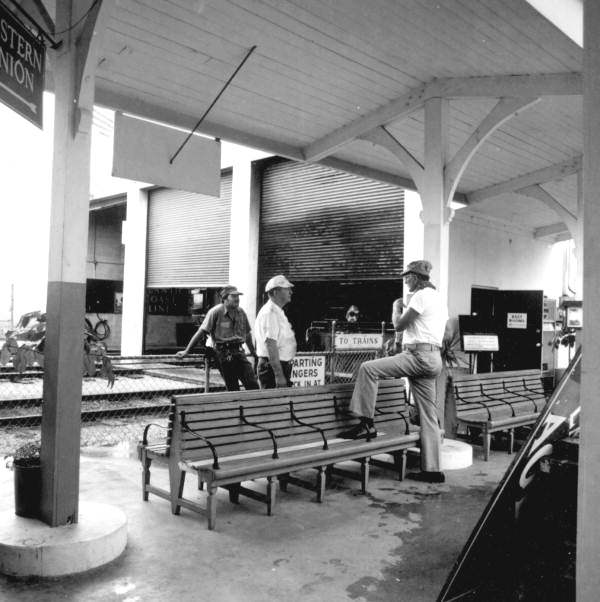 Three employees in the railroad station of the Gold Coast Railroad Museum - Fort Lauderdale, Florida.
