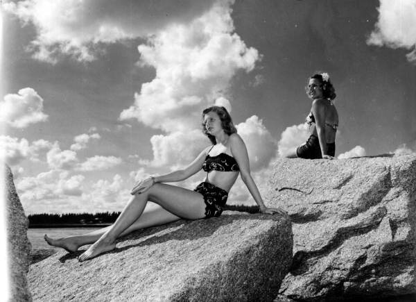 Elsie Andersen (left) and Florence Lainhart basking in the sun on a jetty - Singer Island, Riviera Beach, Florida.