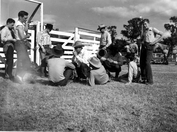 Group of typical Florida cowboys discussing events of Lakeland Rodeo - Lakeland, Florida