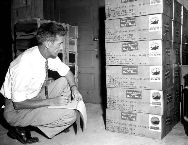 An employee checks for sending out new radios made by the Communications, Inc. - Coral Gables, Florida