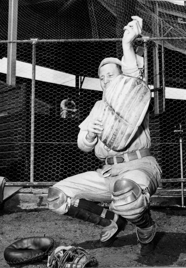 Catcher Johnny Procyk dons catching gear.