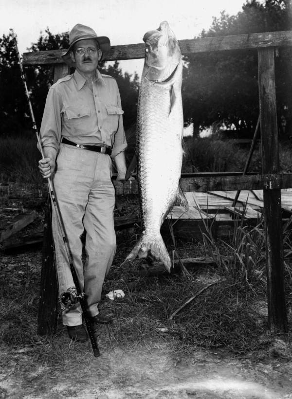 Roy C. Beckman poses with his 72 pound tarpon catch