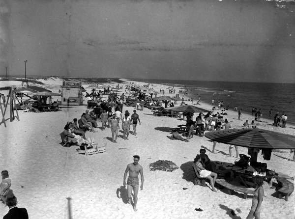 People enjoying the sun and surf.